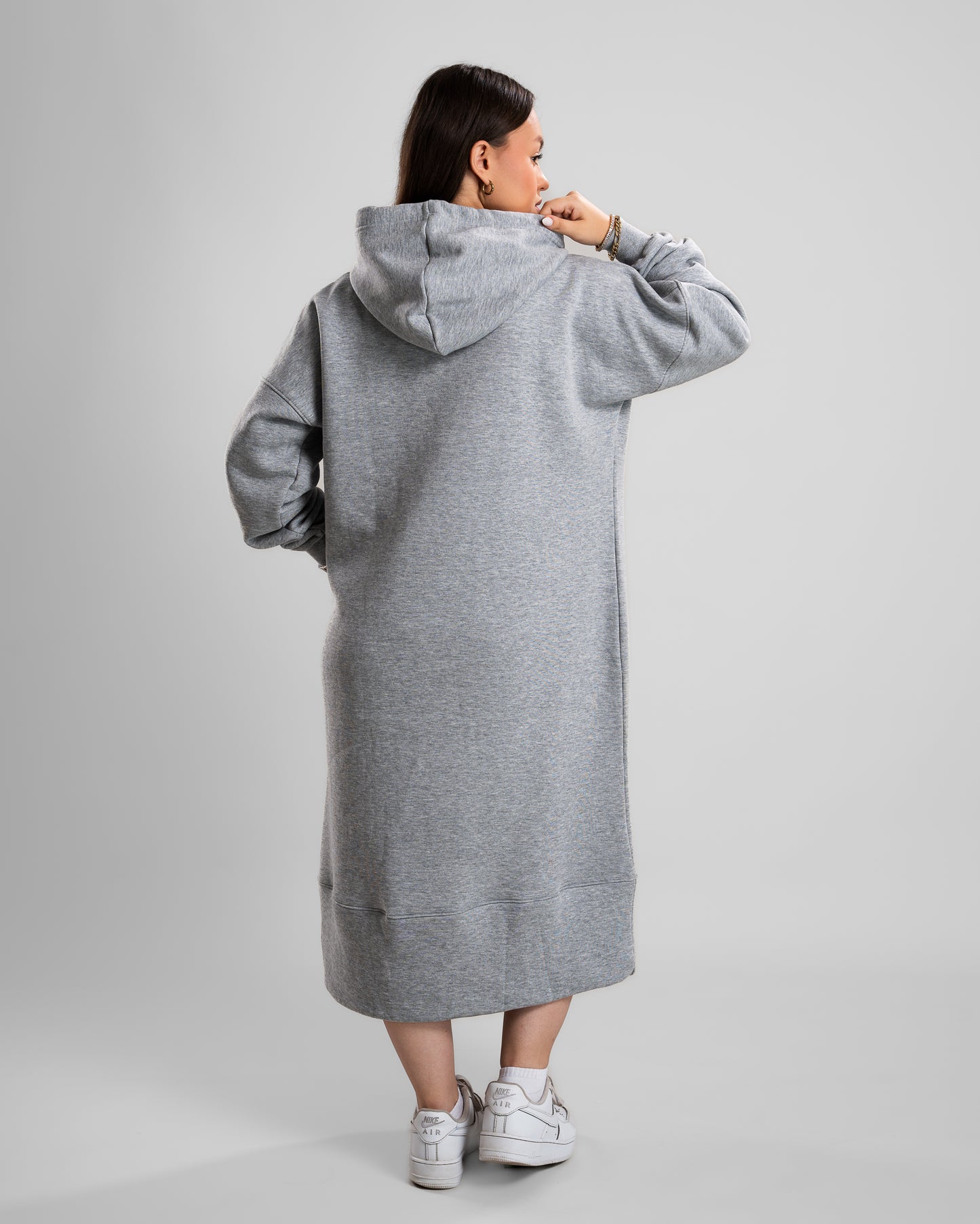 back view of Model in a grey Hoodie Long Dress with thick Melton fabric, cozy and stylish.